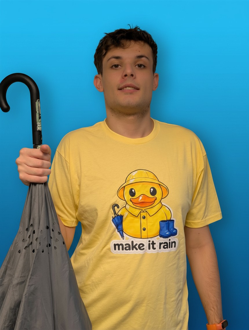 Michael in the yellow Make It Rain Beaks tee with an umbrella